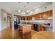 Modern kitchen featuring wood cabinets, granite counters, stainless steel appliances and a center island at 1057 W Century Dr # 112, Louisville, CO 80027