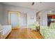 Open living room featuring stylish furniture, hardwood floors, and a sliding barn door at 1057 W Century Dr # 112, Louisville, CO 80027