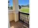 Outdoor porch has wood flooring and faces the yard at 1368 Royal Troon Dr, Castle Rock, CO 80104