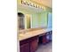 Bright bathroom with a double vanity, large mirror, and separate shower and tub at 1368 Royal Troon Dr, Castle Rock, CO 80104