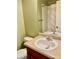 Functional bathroom featuring a single sink vanity with a large mirror and shower at 1368 Royal Troon Dr, Castle Rock, CO 80104