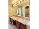 Elegant bathroom featuring dual sinks, vanity with ample counter space, and glass-enclosed shower at 1368 Royal Troon Dr, Castle Rock, CO 80104