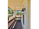 Covered front porch with wood flooring and view of the front yard at 1368 Royal Troon Dr, Castle Rock, CO 80104