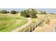 Scenic golf course view with walking path, lush greenery and rolling hills, surrounded by natural beauty at 1368 Royal Troon Dr, Castle Rock, CO 80104