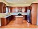 Spacious kitchen featuring stainless steel appliances, granite counters, and wood cabinetry at 1368 Royal Troon Dr, Castle Rock, CO 80104