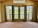 Living room is naturally lit and has neutral walls and views of a manicured lawn at 1368 Royal Troon Dr, Castle Rock, CO 80104