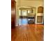 Open-concept living space featuring hardwood floors, fireplace and seamless flow at 1368 Royal Troon Dr, Castle Rock, CO 80104