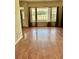 Bright living room boasting hardwood floors and a large window with backyard views at 1368 Royal Troon Dr, Castle Rock, CO 80104