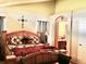 Large bedroom with decorative southwestern style furnishings and an ensuite bathroom at 1368 Royal Troon Dr, Castle Rock, CO 80104