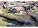 Aerial view of a home featuring solar panels, a backyard, a patio, and neighborhood at 715 Zang St, Lakewood, CO 80401