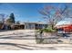 Charming single-story home with a covered carport and a well-maintained front yard at 715 Zang St, Lakewood, CO 80401