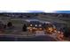 Aerial view of a residential home with a three-car garage and a golf course view at 7965 S Titus Ct, Aurora, CO 80016