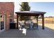 Backyard view showcasing the outdoor gazebo and patio in a large grass yard perfect for entertaining at 7965 S Titus Ct, Aurora, CO 80016