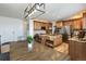 Well-equipped kitchen with a central island, stainless steel appliances, and wooden cabinetry at 7965 S Titus Ct, Aurora, CO 80016