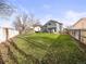 Expansive backyard with lush green grass, enclosed by fencing for privacy and security at 4010 E 129Th Way, Thornton, CO 80241