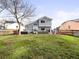 Landscaped backyard featuring a patio with a hot tub and outdoor seating, perfect for relaxation and entertaining at 4010 E 129Th Way, Thornton, CO 80241