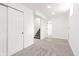 Spacious unfinished basement with new carpeting, clean white walls, and ample room at 1617 S Quitman St, Denver, CO 80219