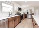 Bright and open kitchen with white counters and stainless steel appliances at 1617 S Quitman St, Denver, CO 80219