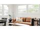 Inviting living room with a leather sofa, natural light, and stylish decor at 1617 S Quitman St, Denver, CO 80219
