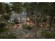 An aerial view of the backyard and house with wooded privacy at 18971 Shadowood Dr, Monument, CO 80132