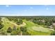 Beautiful aerial view of golf course community nestled amongst rolling green hills and verdant forestry at 18971 Shadowood Dr, Monument, CO 80132