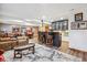 Finished basement with bar, seating area, and sports memorabilia displays at 18971 Shadowood Dr, Monument, CO 80132