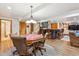 Spacious basement with a game table, seating area, and wet bar at 18971 Shadowood Dr, Monument, CO 80132
