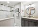 Modern bathroom featuring a marble vanity and a sleek glass shower at 18971 Shadowood Dr, Monument, CO 80132