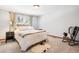 Cozy bedroom with plush carpet, rocking chair, and a fluffy rug at 18971 Shadowood Dr, Monument, CO 80132