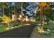 Inviting front of home with landscaped driveway and well-lit exterior at 18971 Shadowood Dr, Monument, CO 80132