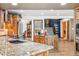 Spacious kitchen with granite countertops, stainless steel appliances, and a center island with wooden cabinetry at 18971 Shadowood Dr, Monument, CO 80132