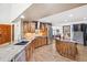 Well-equipped kitchen featuring an island, stainless steel appliances, and custom cabinets at 18971 Shadowood Dr, Monument, CO 80132