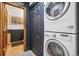 Convenient laundry area with a stacked washer and dryer unit at 18971 Shadowood Dr, Monument, CO 80132