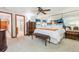 Comfortable bedroom featuring neutral carpet and a large mirror wall at 18971 Shadowood Dr, Monument, CO 80132