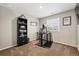 Bedroom setup as an office featuring a computer desk and black bookshelf at 6833 Longpark Dr, Parker, CO 80138