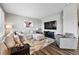 Spacious living room boasts a large sectional sofa, stylish rug, and contemporary design at 6833 Longpark Dr, Parker, CO 80138