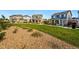 Attractive, modern homes featuring manicured lawns and stone accents create a welcoming street view appeal at 6833 Longpark Dr, Parker, CO 80138