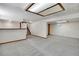 Finished basement with carpet, a stylish bar area with a wooden countertop, and recessed lighting at 9386 W Geddes Pl, Littleton, CO 80128