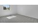 Clean and bright bedroom with soft carpet, fresh white walls, and a window showcasing natural outdoor light at 9386 W Geddes Pl, Littleton, CO 80128
