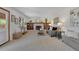 Comfortable living room with a fireplace, built-in shelving, and plenty of natural light at 9386 W Geddes Pl, Littleton, CO 80128