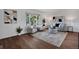 Cozy living room with stylish furniture, decorative rug, and plenty of natural light at 9386 W Geddes Pl, Littleton, CO 80128