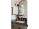 Stylish bathroom vanity with dark countertop and a modern faucet at 353 Columbine Ave, Broomfield, CO 80020