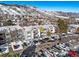 Aerial view of the apartment building with parking and mountain backdrop at 451 Golden Cir # 210, Golden, CO 80401