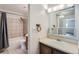 Tiled bathroom with shower-tub combo and vanity with sink at 451 Golden Cir # 210, Golden, CO 80401