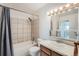 Tiled bathroom with shower-tub combo and vanity with sink at 451 Golden Cir # 210, Golden, CO 80401