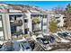 Apartment building exterior with balconies, parking and snowy mountain backdrop at 451 Golden Cir # 210, Golden, CO 80401