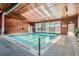 Indoor swimming pool featuring a wood paneled roof and walls, and a large window at 451 Golden Cir # 210, Golden, CO 80401