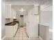 Functional kitchen featuring white appliances, a closet, and overhead storage at 451 Golden Cir # 210, Golden, CO 80401