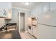 Kitchen features stainless steel sink, white appliances, and ample cabinet space at 451 Golden Cir # 210, Golden, CO 80401