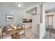 Open concept kitchen and dining area with white cabinets and sleek black countertops at 451 Golden Cir # 210, Golden, CO 80401